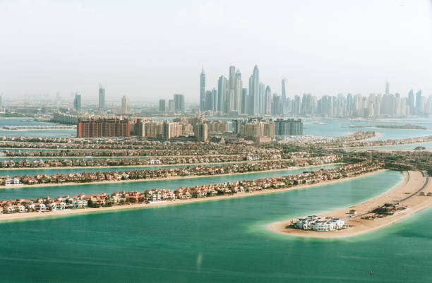 Aerial view of modern skyline and artificial islands, illustrating business opportunities in Ajman Free Zone.